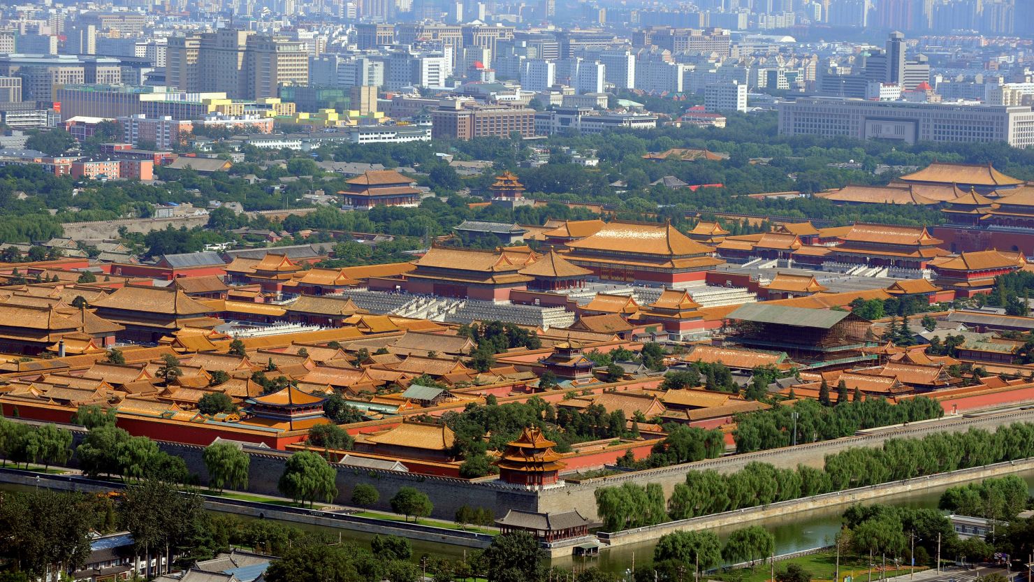 This aerial photo taken on August 2, 2008 shows Beijing's Forbidden City and new skyscrapers in the Chinese capital ahead of the Beijing 2008 Olympic Games.  Weather forecasters predicted thunder and rain in Beijing on the day of the Olympic opening ceremony and warned that typhoons could disrupt events in other host cities.   AFP PHOTO/GOH CHAI HIN        (Photo credit should read GOH CHAI HIN/AFP via Getty Images)