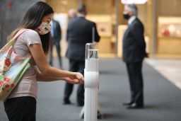 A woman sanitizes her hands at the mall at Hudson Yards on Sept. 9 in New York City. As winter approaches, people need to stay vigilant about pandemic safety precautions.