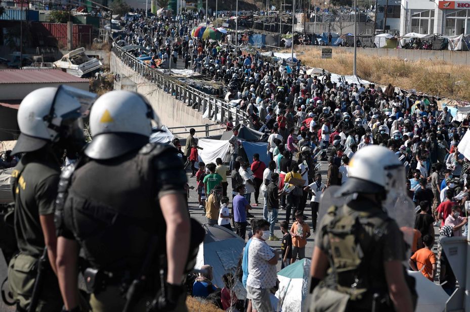 Migrants call for their resettlement Friday, September 11, after a fire destroyed the Moria camp on the Greek island of Lesbos.