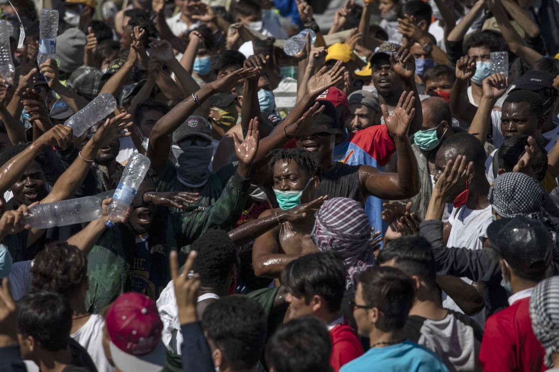 Migrants take part in a rally near the town of Mytilene, Lesbos on Friday after Moria, Europe's largest refugee camp, was destroyed by fires.