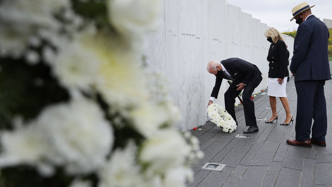 Then-Democratic presidential nominee and former Vice President Joe Biden and Dr. Jill Biden are accompanied by Calvin Wilson as they lay a wreath at the Flight 93 National Memorial on the 19th anniversary of the 9/11 terror attacks September 11, 2020 in Shanksville, Pennsylvania. 