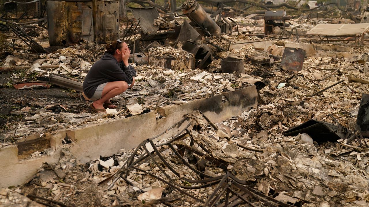 Desiree Pierce cries as she visits her home destroyed by the Almeda Fire in Talent, Oregon, on Friday, Sept. 11, 2020. "I just needed to see it, to get some closure," she said.