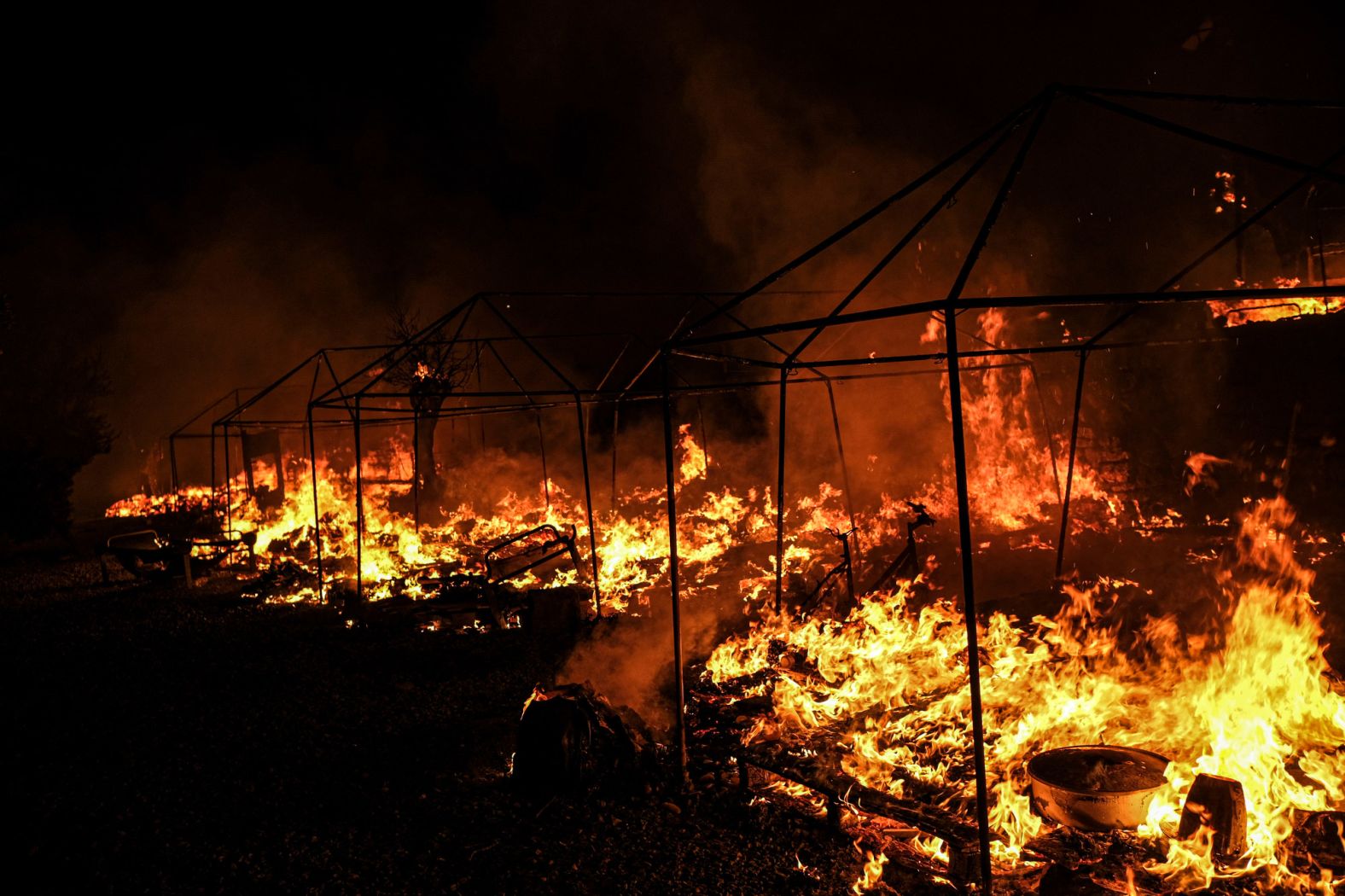 Fires rage in the Moria camp on September 9. Greek authorities said the fires appeared to have been deliberately lit after quarantine rules were imposed on residents who had tested positive for coronavirus. The camp was put under lockdown after 35 people tested positive for Covid-19.