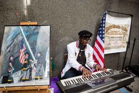 Keith Gadson plays a tune on his keyboard to honor the lives lost 19 years ago.