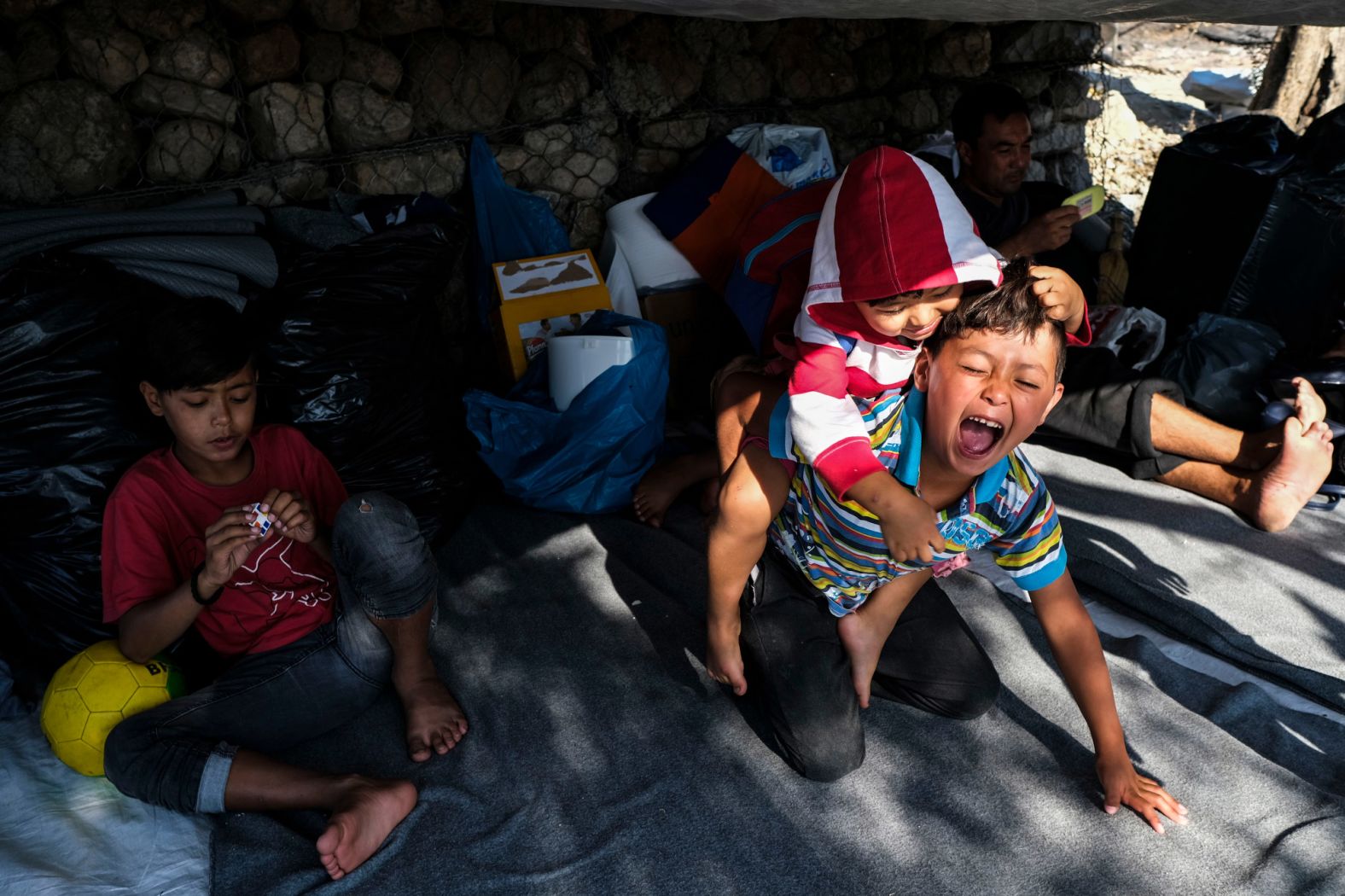 Migrant children play at their new tent on September 11.