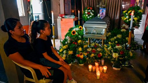 A woman and a girl attend the wake of murdered Mexican journalist Julio Valdivia in Tezonapa.