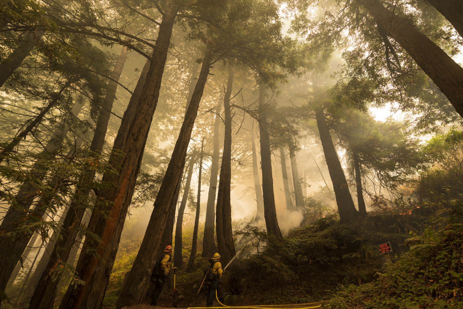 A firefighter shoots an incendiary device during a back burn to help control the Dolan Fire in Big Sur, California, on September 11, 2020.