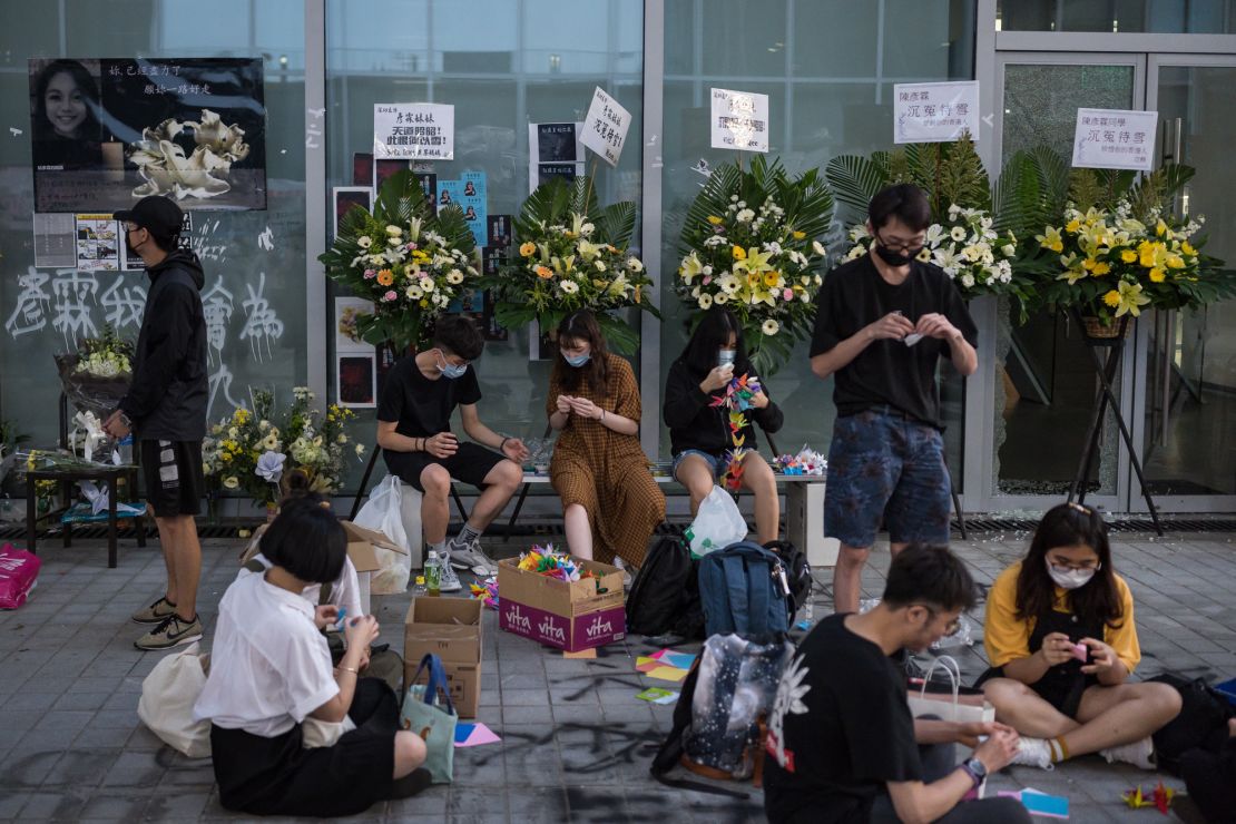 People fold paper cranes at the Hong Kong Design Institute as part of a memorial to Chan on October 17, 2019.