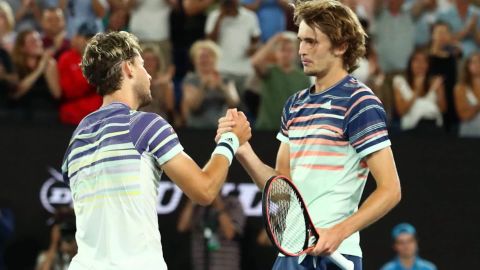 Thiem and Zverev meet at the net following the Austrian's victory. 