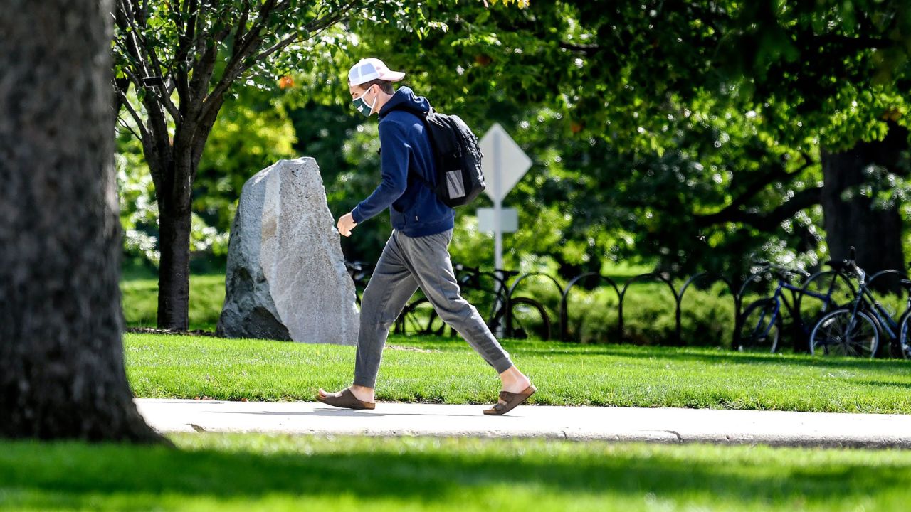 A masked student on the campus of Michigan State University in East Lansing on Friday.