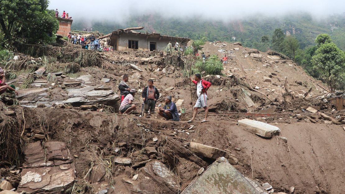 Residents and rescue workers search for landslide victims in Sindhupalchok District.