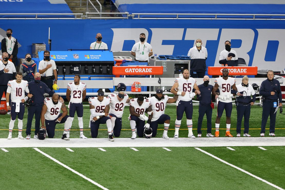 Chicago Bears players kneel 
during the National Anthem before the first half of an NFL football game against the Detroit Lions  in Detroit, Michigan USA, on Sunday, September 13, 2020.