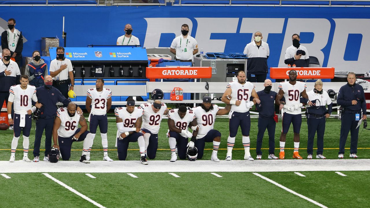Chicago Bears players kneel during the National Anthem before the first half of an NFL football game against the Detroit Lions  in Detroit, Michigan USA, on Sunday, September 13, 2020.