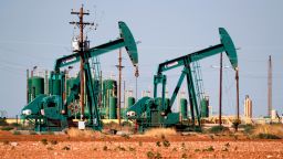 Pump jacks are shown in an oil field, Wednesday, July 29, 2020, in Midland, Texas. (AP Photo/Tony Gutierrez)