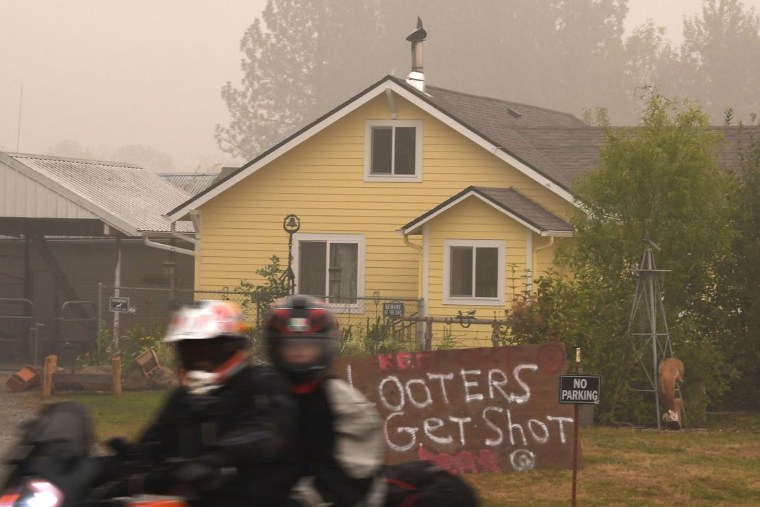A sign reads "Looters Get Shot" outside a residence in Molalla, Oregon, in Clackamas County. 