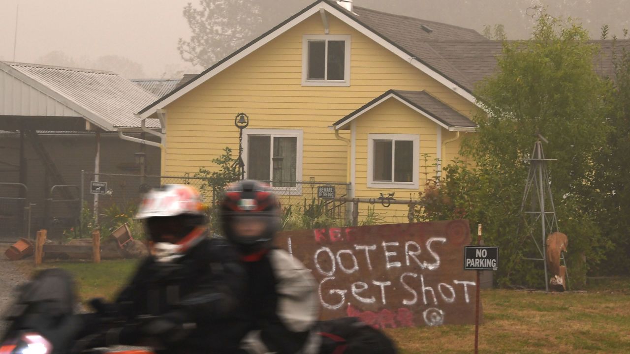 A sign reads "Looters Get Shot" outside a residence in Molalla, Oregon, in Clackamas County.