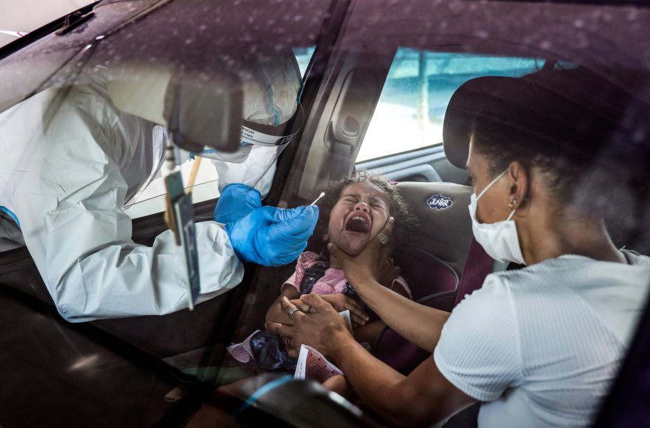 A girl cries as she is tested for Covid-19 at a drive-thru testing station in East Jerusalem on September 6.