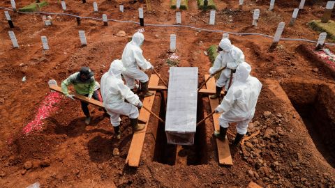A coronavirus victim is buried at a cemetery in Jakarta, Indonesia, on September 8.