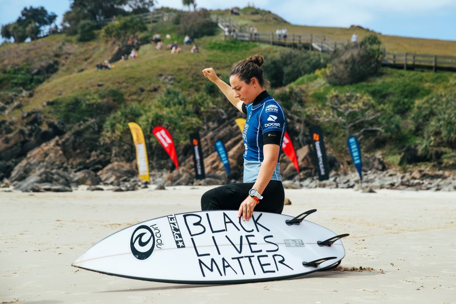 Tyler Wright, a two-time World Surf League Champion, takes a knee before competing in an event in Tweed Heads South, Australia, on September 13.