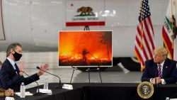 President Donald Trump listens as California Gov. Gavin Newsom speaks during a briefing at Sacramento McClellan Airport, in McClellan Park, Calif., Monday, Sept. 14, 2020, on the western wildfires. 