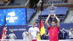 NEW YORK, NEW YORK - SEPTEMBER 13: Dominic Thiem (R) of Austria celebrates with championship trophy after winning in a tie-breaker during his Men's Singles final match against Alexander Zverev (L) of Germany on Day Fourteen of the 2020 US Open at the USTA Billie Jean King National Tennis Center on September 13, 2020 in the Queens borough of New York City. (Photo by Matthew Stockman/Getty Images)