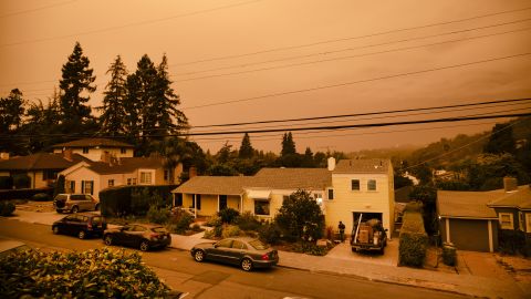 Smoke fills the air over homes in Oakland, California, U.S., on Wednesday, Sept. 9, 2020. California's worst fire season on record is about to ramp up as a hot, dry autumn promises even more destruction, blackouts and evacuations.