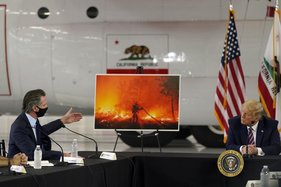 President Donald Trump listens as California Gov. Gavin Newsom speaks about the wildfires during a briefing on September 14, 2020.