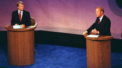 President Gerald Ford speaks as Jimmy Carter listens during the first of three debates at Philadelphia's Walnut Street Theater in 1976.