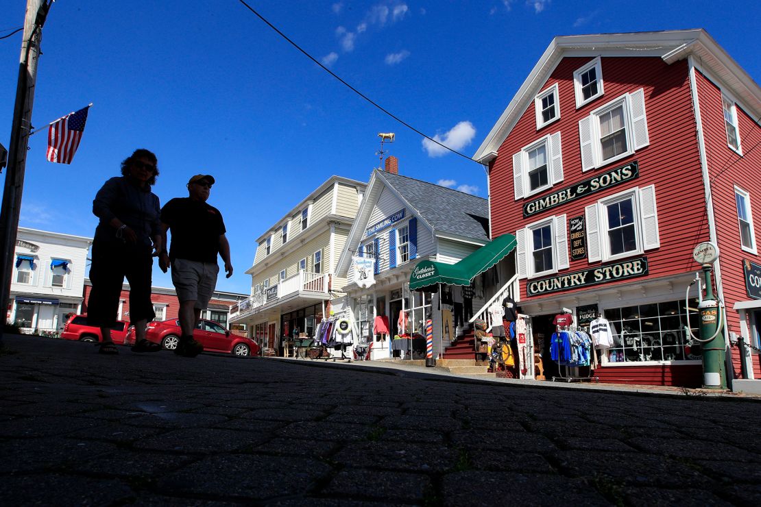 Tourists walk by shops in Boothbay Harbor, Maine in June. By early September, Maine's economy was operating at 93% of where it was before the pandemic, according to the Back-to-Normal Index. (AP Photo/Robert F. Bukaty)