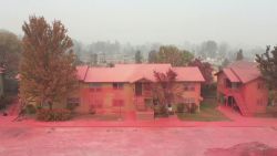 Red fire retardant covered the destroyed streets and homes of Talent, Oregon after wildfires tore through the town.