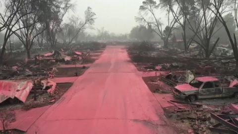 Red fire retardant covered the destroyed streets and homes of Talent, Oregon after wildfires tore through the town.