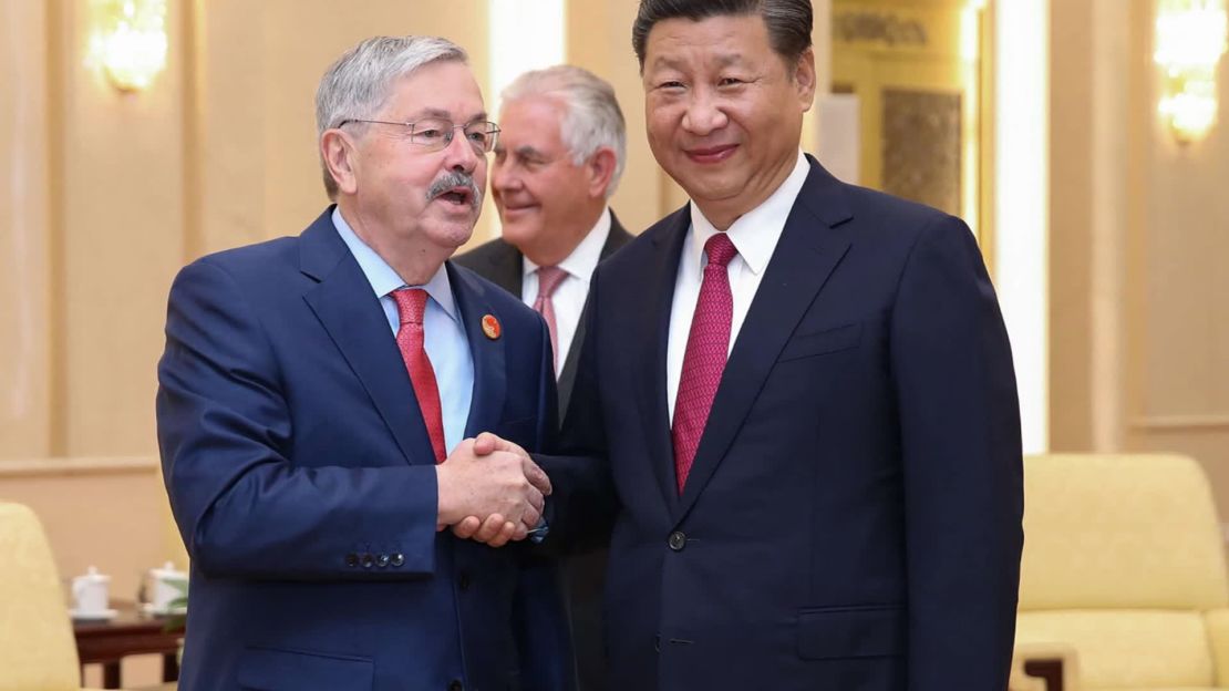Outgoing US ambassador Terry Branstad shakes hands with Chinese President Xi Jinping. The two men have known each other since the 1980s. 