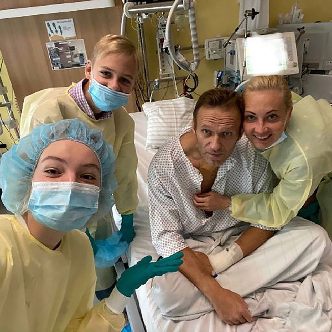 Alexey Navalny sits up in his hospital bed earlier this month.