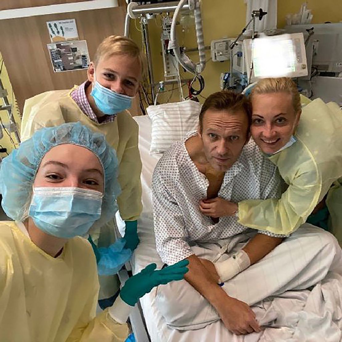 Alexey Navalny sits up in his hospital bed earlier this month. 