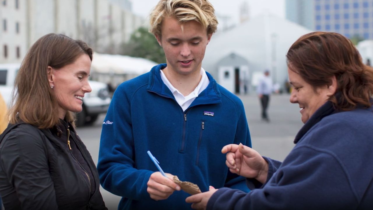 Kevin Barber (center) and his mother, Dr. Carolyn Barber (left), talk to a Wheels of Change worker. Their program is run by the Alpha Project, a San Diego organization providing services to homeless people.