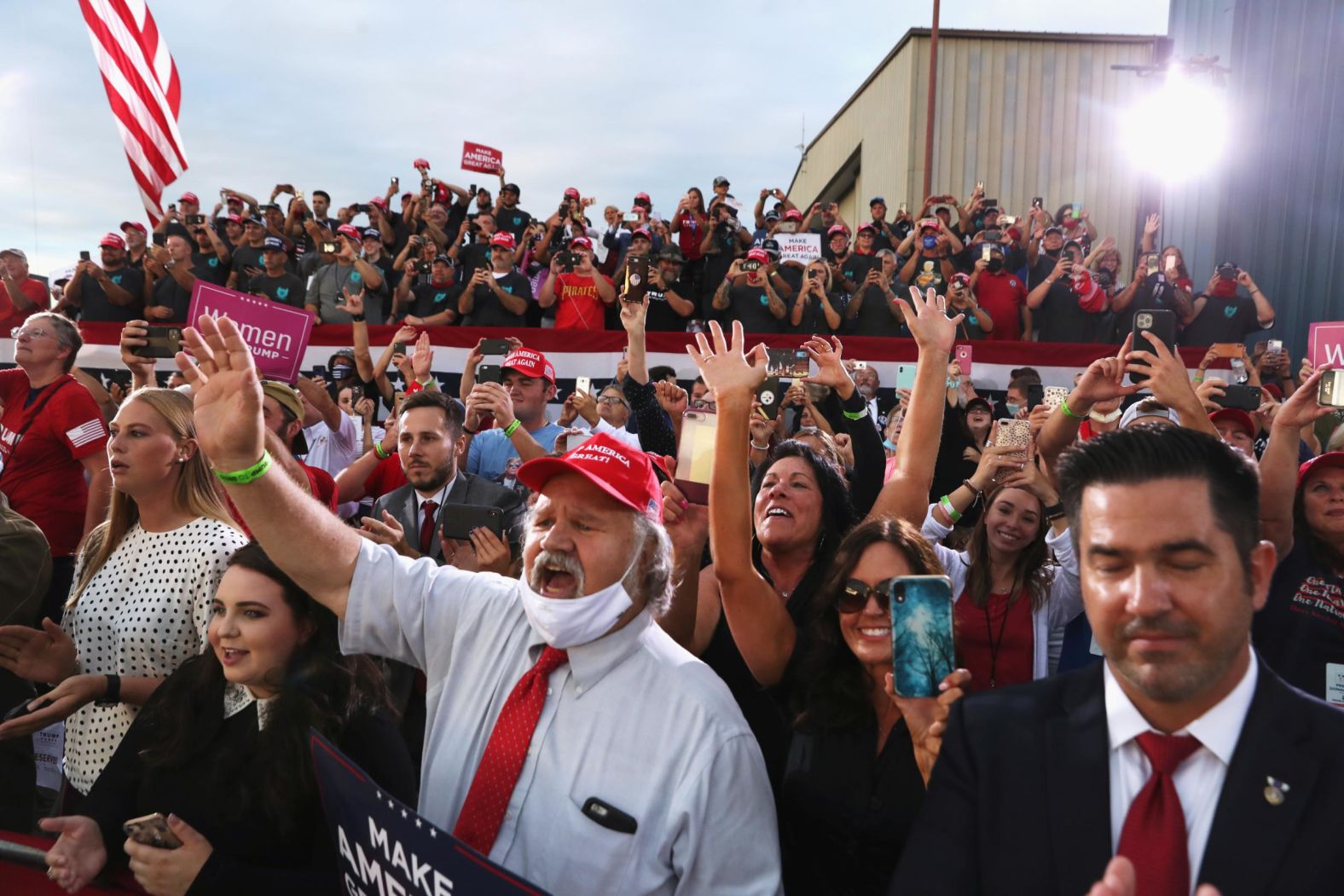 Supporters react as Trump delivers a speech September 3 at Arnold Palmer Regional Airport in Latrobe, Pennsylvania. <a href="index.php?page=&url=https%3A%2F%2Fwww.cnn.com%2F2020%2F09%2F03%2Fpolitics%2Ftrump-biden-coronavirus-mask%2Findex.html" target="_blank">Speaking to a largely maskless crowd,</a> Trump at one point mocked Biden: "Did you ever see a man that likes a mask as much as him?"