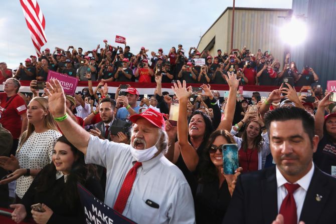 Supporters react as Trump delivers a speech September 3 at Arnold Palmer Regional Airport in Latrobe, Pennsylvania. <a  target="_blank">Speaking to a largely maskless crowd,</a> Trump at one point mocked Biden: "Did you ever see a man that likes a mask as much as him?"