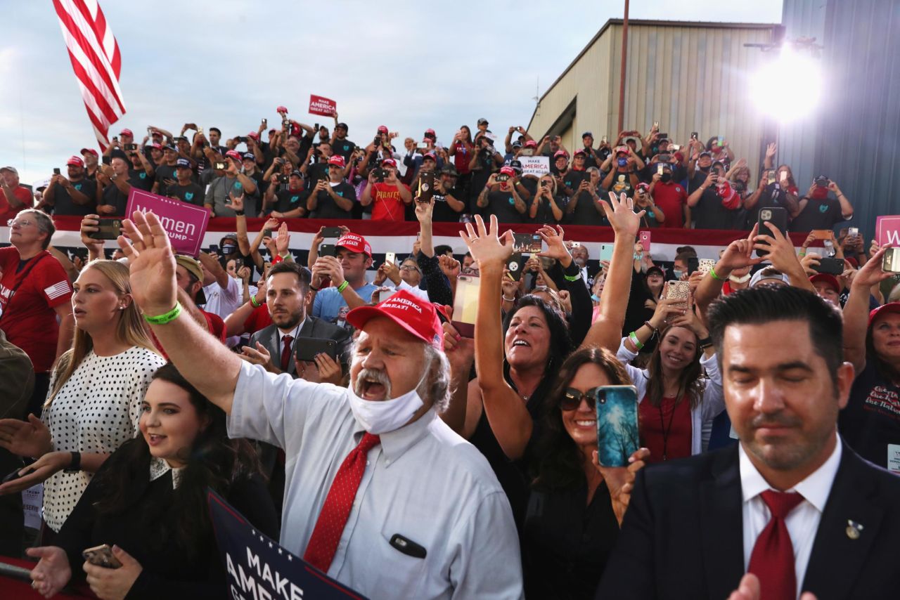 Supporters react as Trump delivers a speech September 3 at Arnold Palmer Regional Airport in Latrobe, Pennsylvania. <a href="https://www.cnn.com/2020/09/03/politics/trump-biden-coronavirus-mask/index.html" target="_blank">Speaking to a largely maskless crowd,</a> Trump at one point mocked Biden: "Did you ever see a man that likes a mask as much as him?"