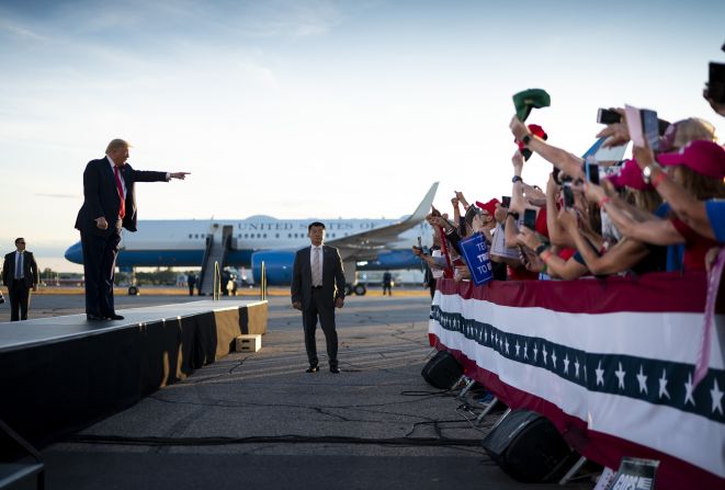 Trump points to his supporters during a rally in Londonderry, New Hampshire, on August 28.