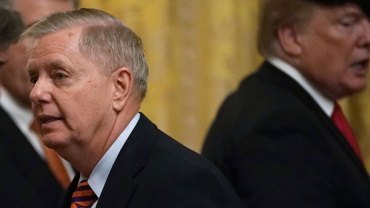 U.S. President Donald Trump (R) and Sen. Lindsey Graham (R-SC) (R) during an East Room event to host the Clemson Tigers football team at the White House January 14, 2019 in Washington, DC.