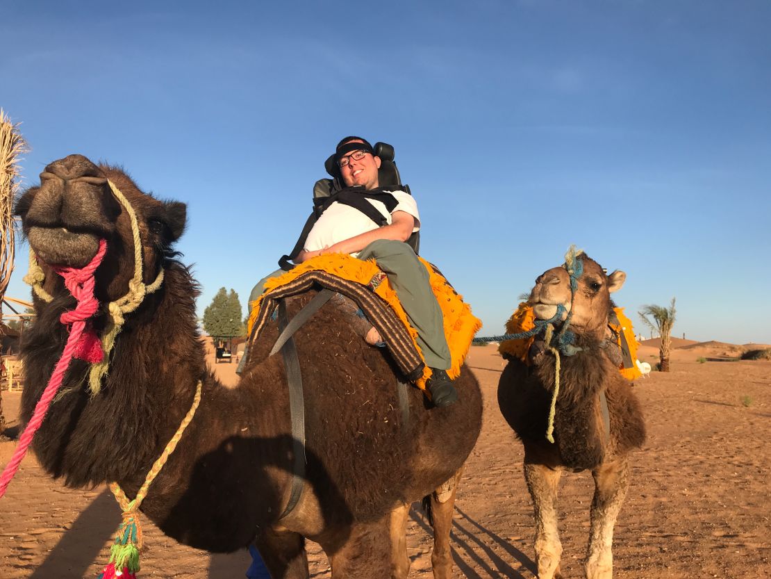 Cory Lee riding a camel in Morocco