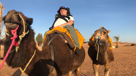 Cory Lee riding a camel in Morocco