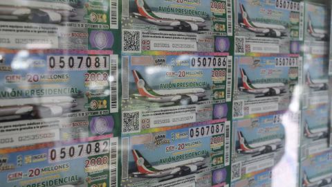 View of lottery tickets depicting the luxurious presidential plane in Mexico City, on March 10, 2020.