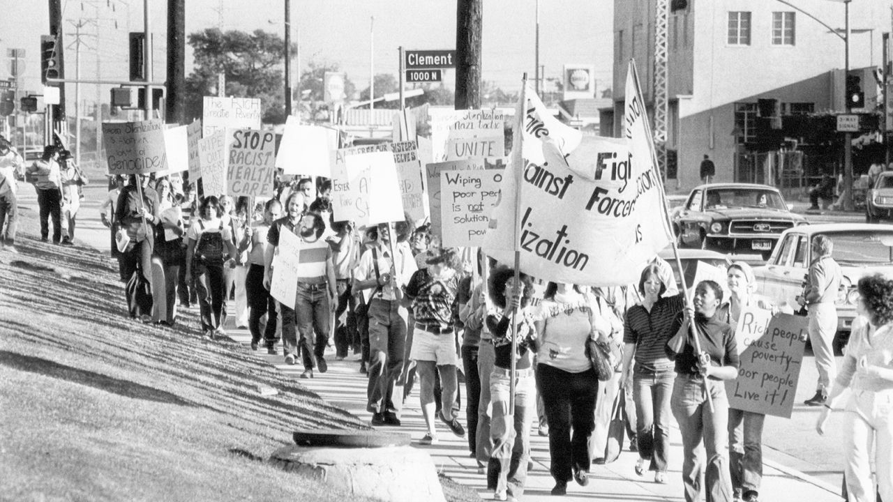Demonstrators march outside at the Los Angeles County USC Medical Center in 1974 at a protest organized by "The Committee to Stop Forced Sterilization." 