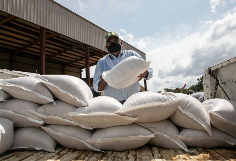 Willie Berry loads sandbags on the back of his truck in Jackson, Mississippi, as he helps a friend prepare for Hurricane Sally on Tuesday, September 15.