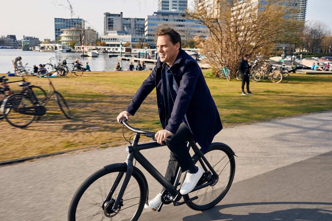 Van Moof CEO Taco Carlier rides one of his company's electric bikes.