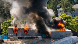 Trailers on a construction site for a youth detention center burn after protesters targeted them during protests in Seattle on July 25, 2020 in Seattle, Washington. Police and demonstrators clash as protests continue in the city following reports that federal agents may have been sent to the city. (Editor's note: Part of this photo has been blurred because of profanity.)