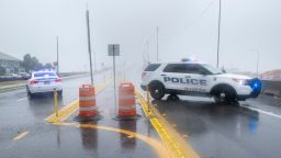 Police vehicles block the entrance to the Pensacola Bay Bridge in Gulf Breeze as Hurricane Sally makes through the area on Tuesday, Sept. 15, 2020.Hurricane Sally Tuesday
