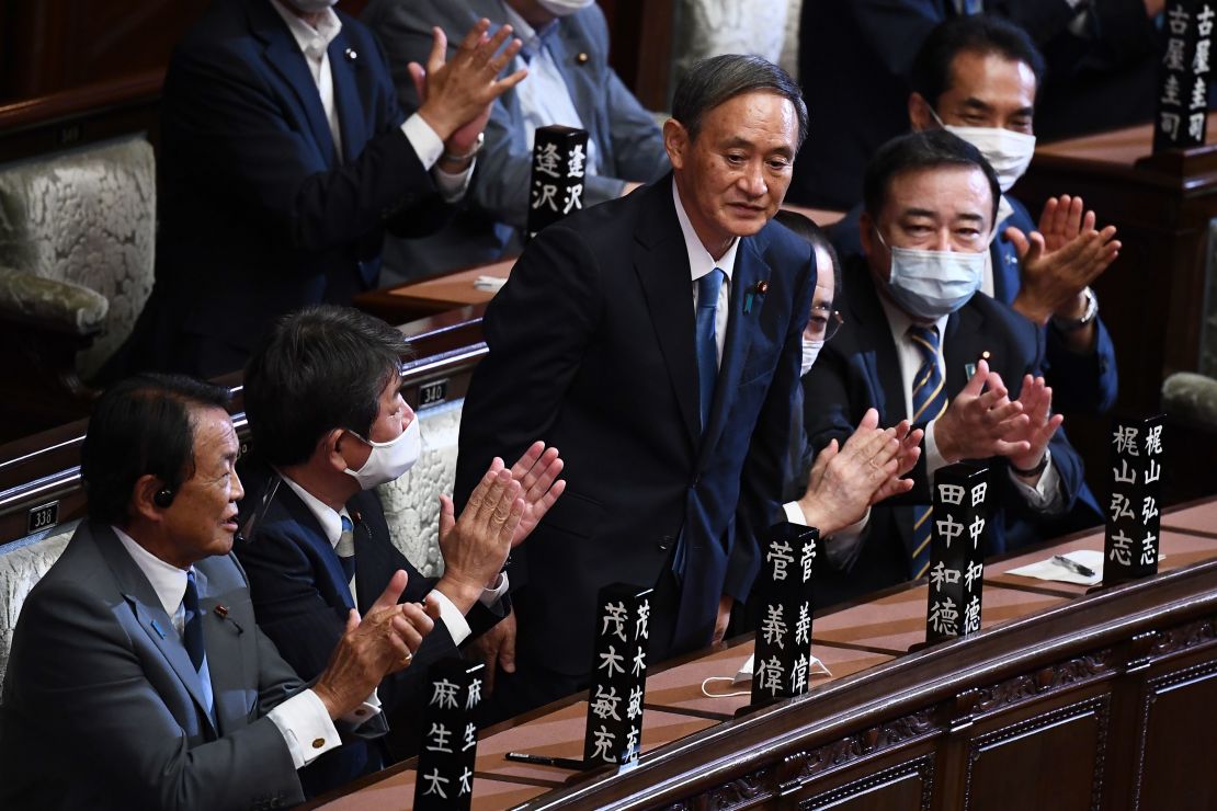 Yoshihide Suga is applauded after he was elected as Japan's Prime Minister by the lower house of the Diet in Tokyo on September 16.