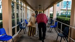 An elderly residents walks inside John Knox Village, a retirement community in Pompano Beach, Florida.